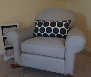 AFTER. This rocker was reupholstered as part of an update to a bedroom. Custom pillow brings it into balance with the space.