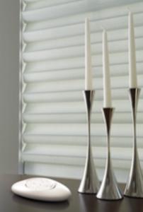Candle Sticks in front of Blinds