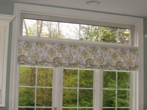 inside-mounted Faux Roman Shade adds color to this kitchen